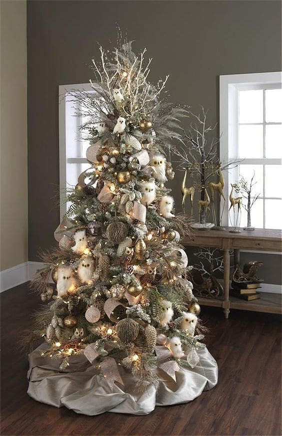 Winter Woodland Christmas tree with owl ornaments, pinecone ornaments, twiggy sprays and frosted, decorative Christmas picks.