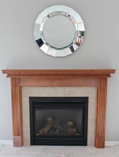 WOW! See this STUNNING fireplace mantel reveal! Learn how to paint a wood mantel in 3 easy steps! DIY tutorial and supply list included. 