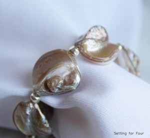 Add some coastal style to your life with these pretty DIY shell napkin rings!