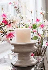 Candle Vignette with pink cherry blossom branches in vase