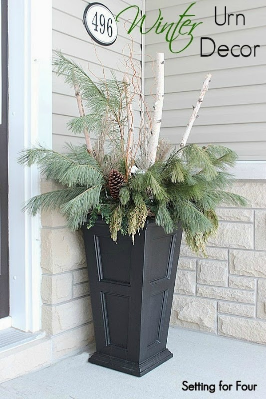 What to decorate and make in January: Winter planter with pine and birch bark on porch