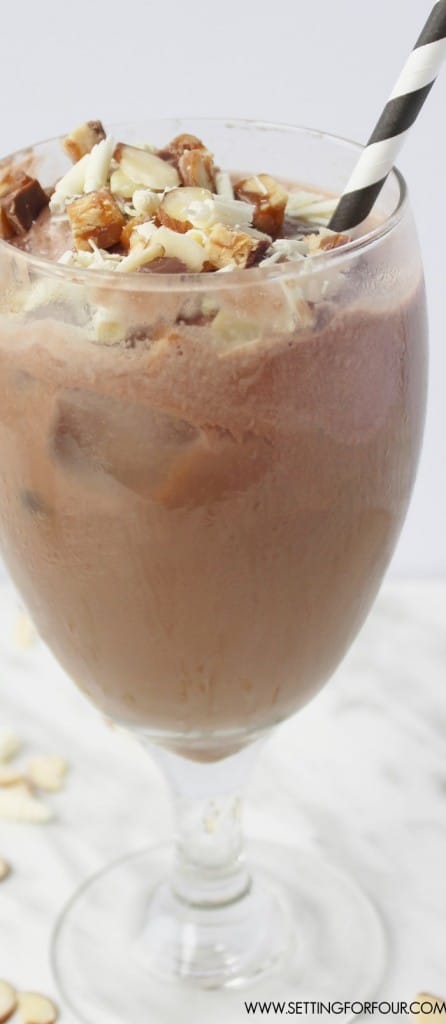 So DELICIOUS!!! If you love chocolate bars, mocha and iced coffee flavors you'll love this drink! Get this sweet tooth satisfying, cold drink recipe for Mocha Iced Coffee Float with White Chocolate Curls and Snickers Crunch Topping!