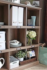 Add storage and organization to your kitchen with a bookcase! See how I organized my entertaining supplies with this gorgeous driftwood finish bookcase!