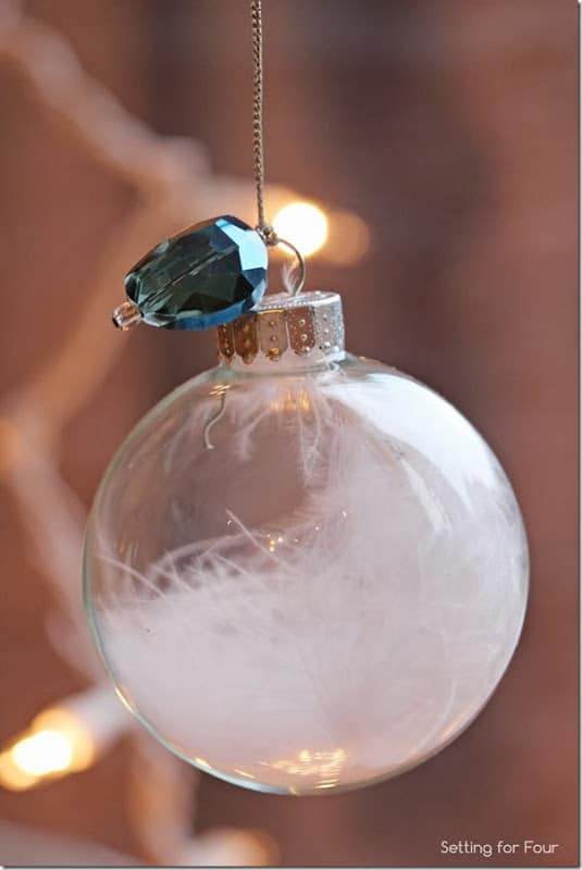 15 Minute is all it takes to make these pretty DIY Jewel and Feather Ball Holiday Ornaments! Hang on your tree or use as a present or gift bag topper! Great handmade Christmas craft and gift idea. | www.settingforfour.com