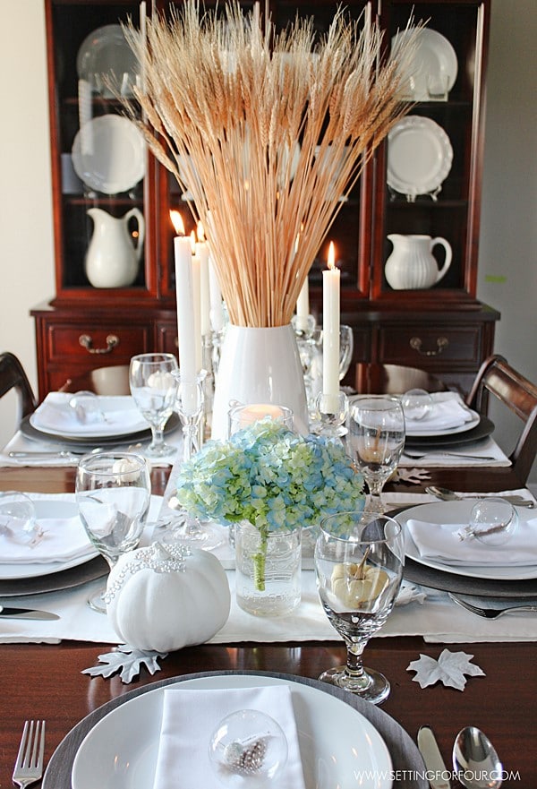 Table decorated for Fall. Centerpiece and place setting ideas. | www.settingforfour.com