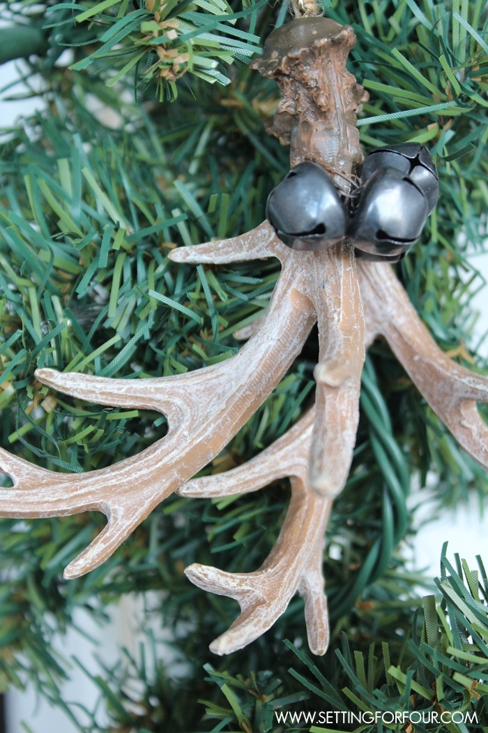 See my Christmas Entryway Decor with Winter Woodland Glam style! Front door wreath and garland decor, urns filled with greenery and birch. www.settingforfour.com