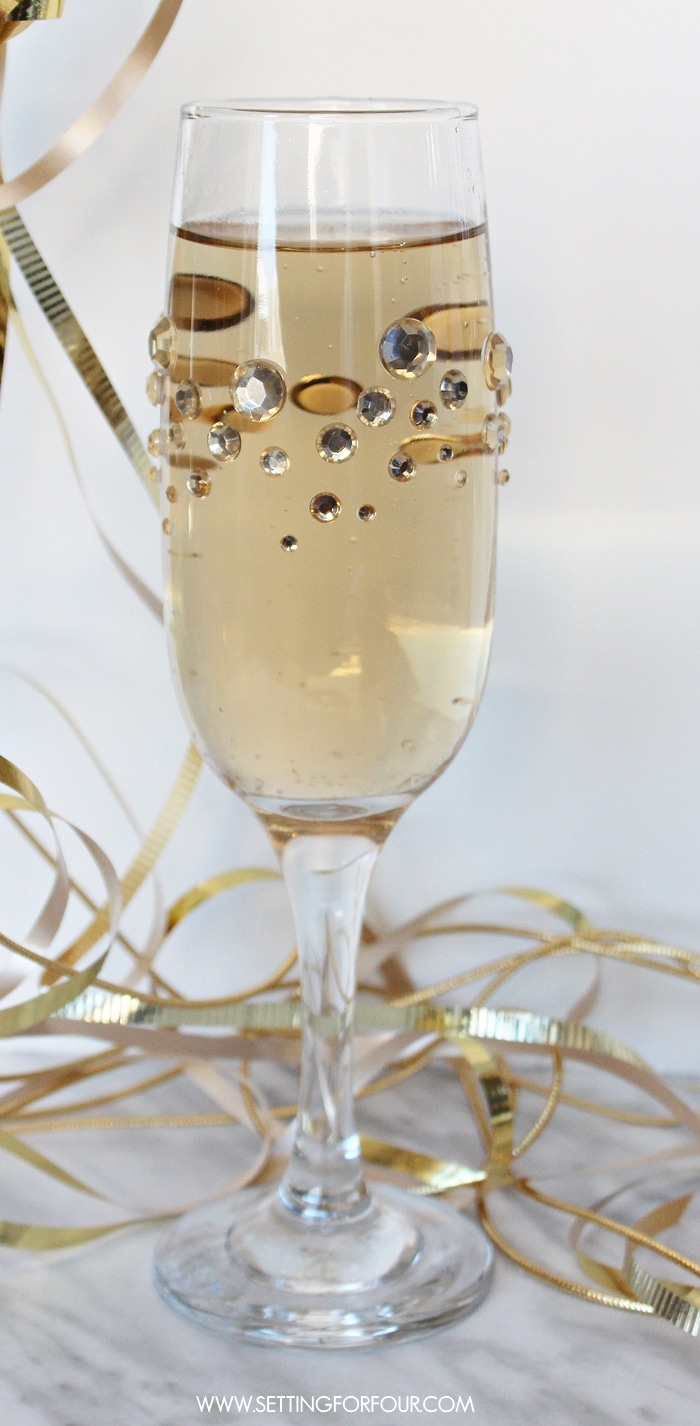 Fast, Fun and Fabulous! Make beautiful, quick and easy DIY Glamourous Crystal Rhinestone Champagne glasses for your next party! Dress up plain party glasses with some pretty sparkle and shine. You won't believe how straightforward this tutorial is! www.settingforfour.com