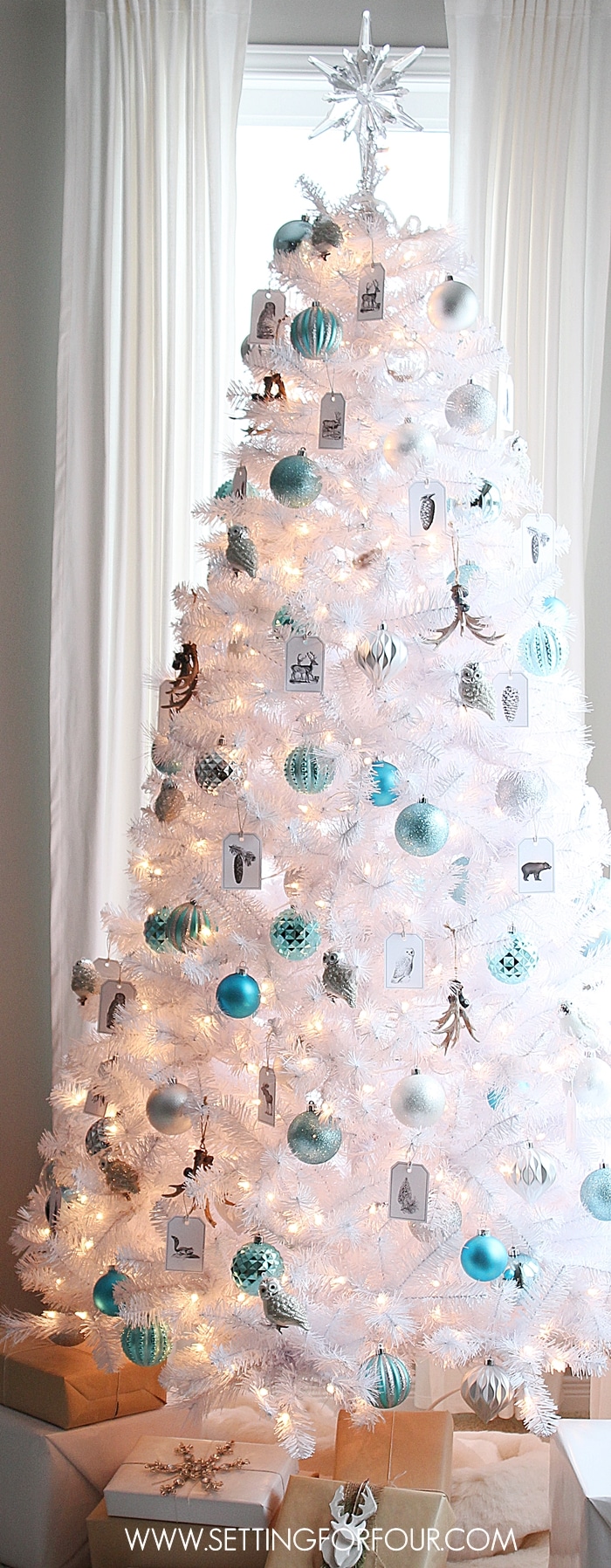 See how I decorated my Winter Woodland Glam White Christmas Tree for the holidays! Woodland animals, metallics and shine! www.settingforfour.com