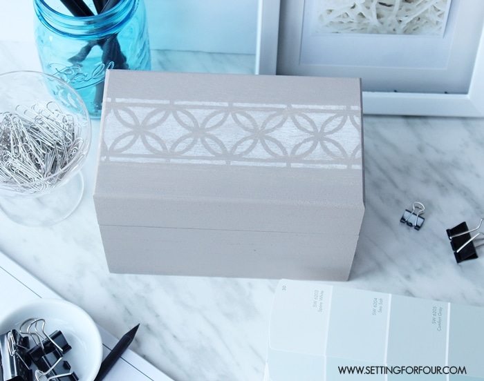 Organizing your desk top to declutter your home office and work space? A decorative painted storage box keeps home office supplies within easy reach and organized.