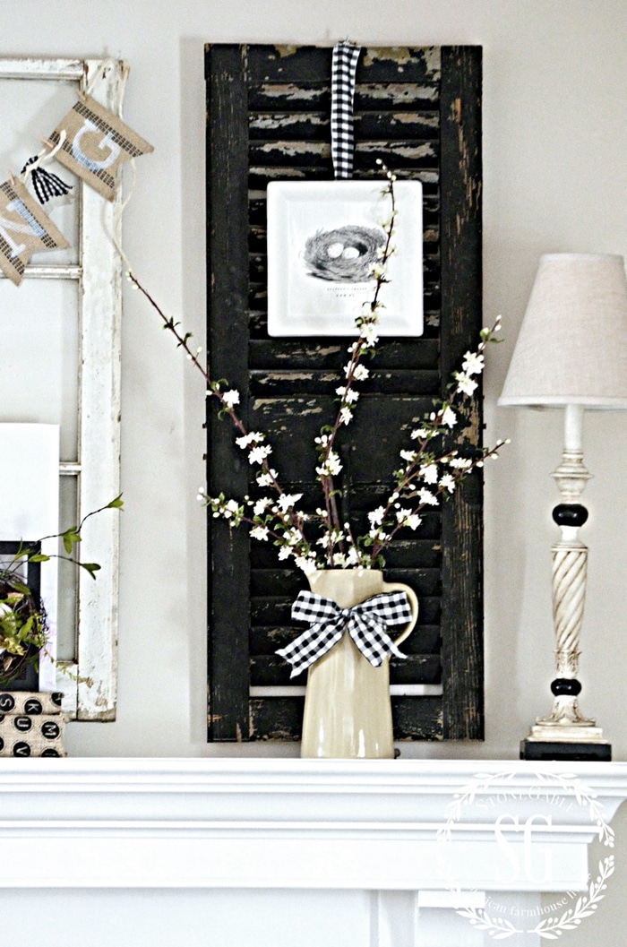  Spring mantel decor with flowers, buralp banner and chippy shutters