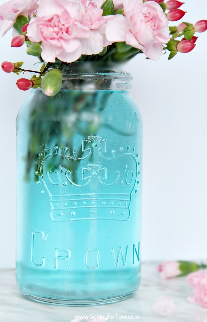 Such a clever DIY tip! This is the quickest, easiest way (ever!) to tint mason jars blue! I can't believe how simple it is to get that perfect vintage blue mason jar color without any messy painting! www.settingforfour.com