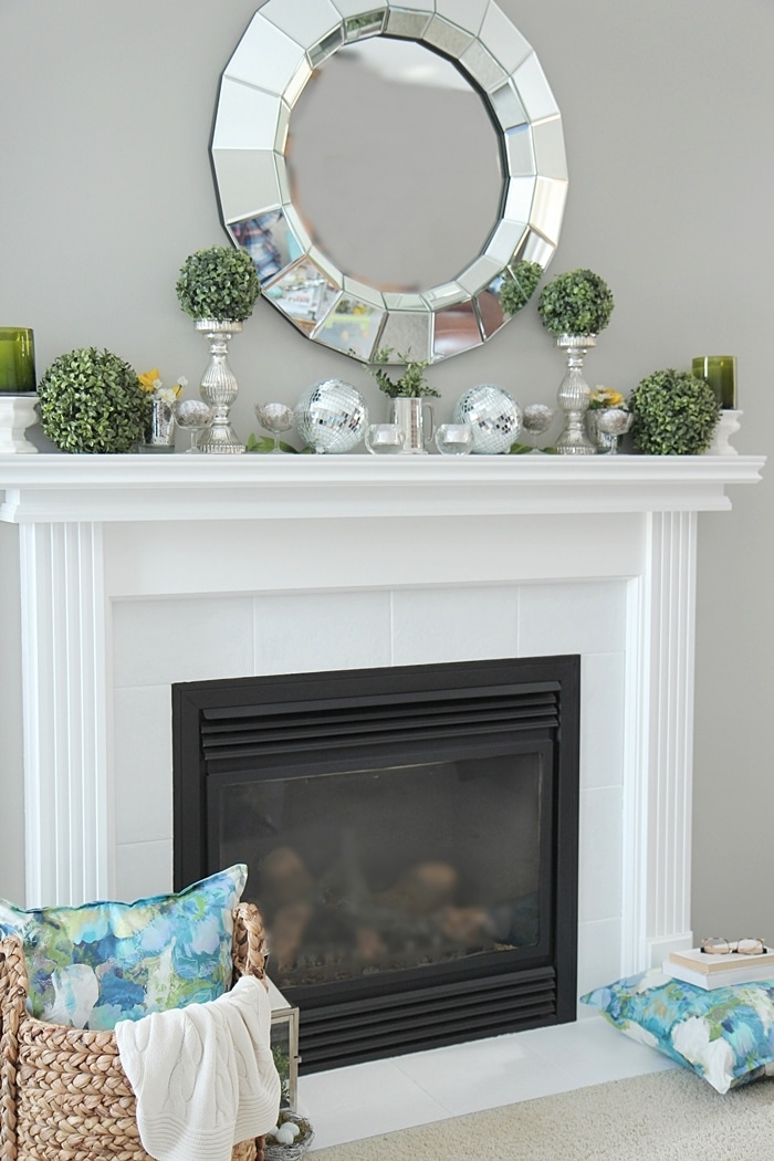 How to Decorate a Spring Mantel with Style. See my mantel filled with pretty Spring accents and color. www.settingforfour.com