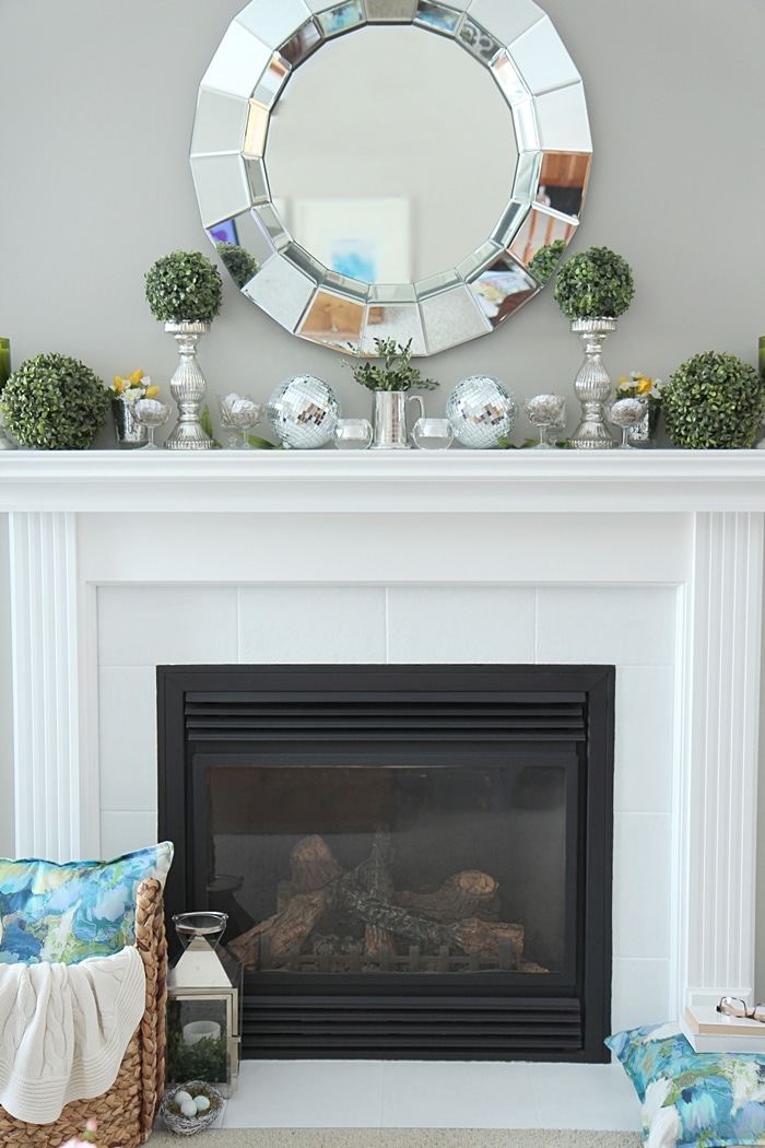 How to Decorate a Spring Mantel with Style. See my mantel filled with pretty Spring accents and color. www.settingforfour.com