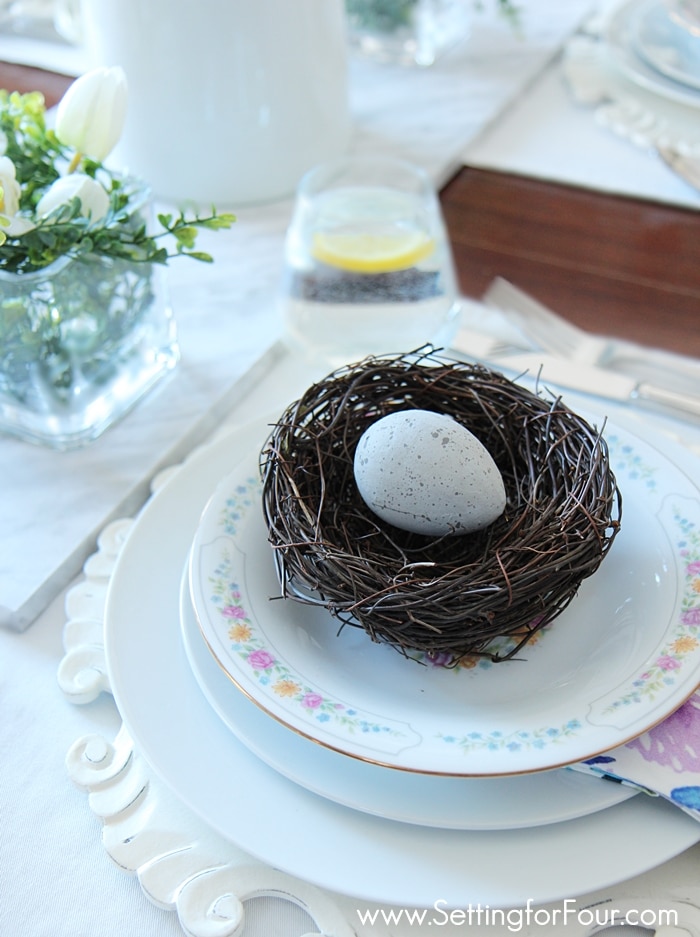 Spring table setting with spring decor ideas - nests and boxwood! www.settingforfour.com