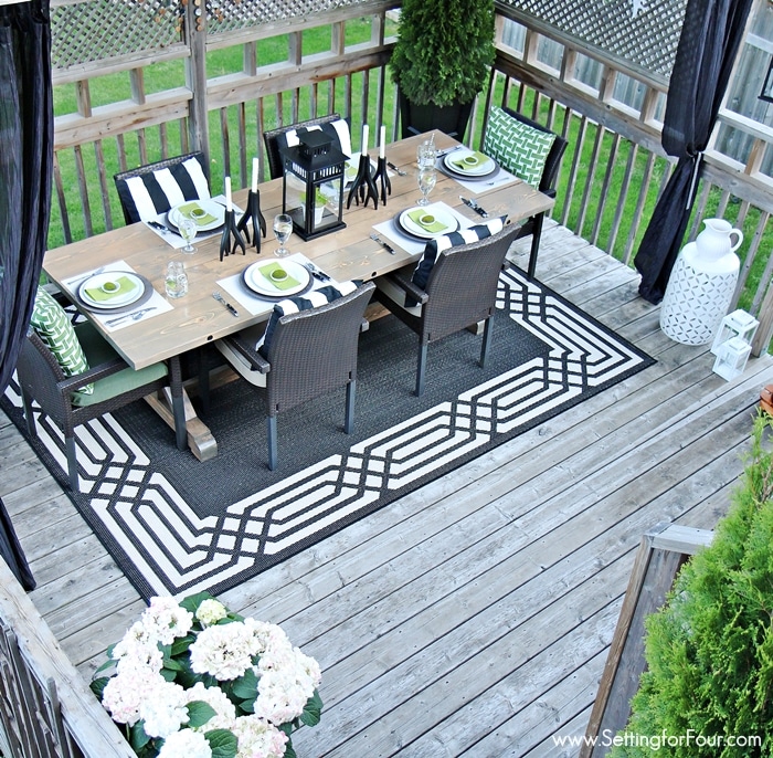 Summer Deck Decorating ideas - see how I decorated our deck 'Summer Lodge' Style with a color palette of black, white and green! www.settingforfour.com