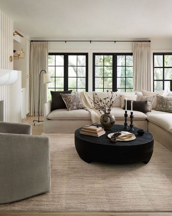 Cozy Neutral Living Room Decor Ideas. small living room, black coffee table, beige, white, neutral sectional sofa black windows, neutral curtains, furniture layout small living room, tiny living room ideas, coffee table decor ideas, minimalist, transitional, modern