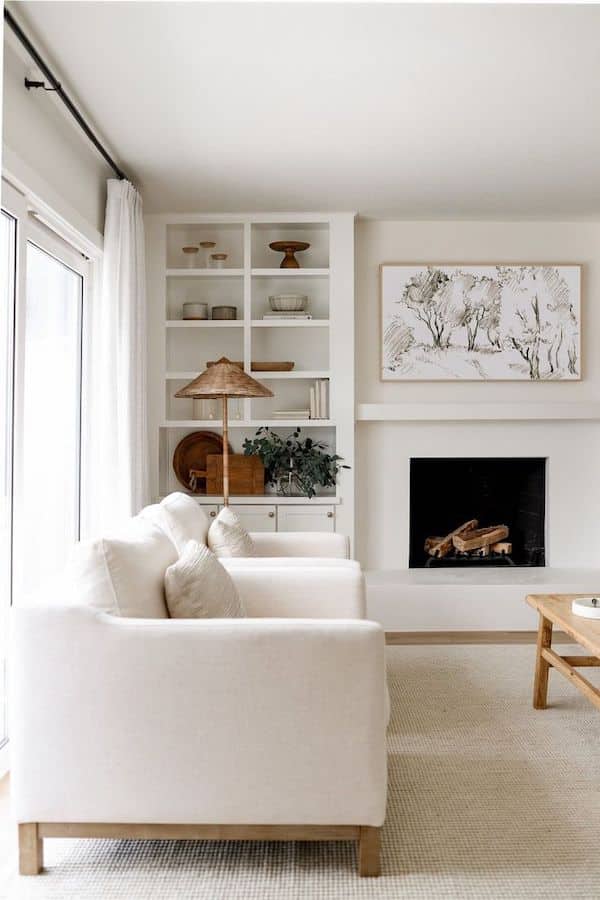 Cozy Neutral Living Room Decor and Builtin Bookshelf Ideas. modern, transitional, farmhouse, white walls, color palette, color scheme, neutral chairs and neutral sofa, art above fireplace, wall art, bookshelf decor ideas, 
