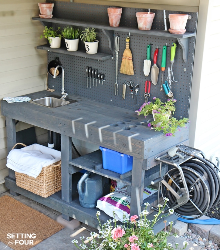 Make this DIY Potting Bench from free pallets! Has running water, storage and hose for watering your flowers!