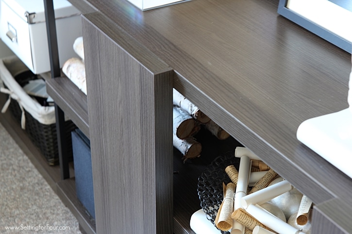 This console table in a home office is a clever storage idea for placing the printer and decor. www.settingforfour.com