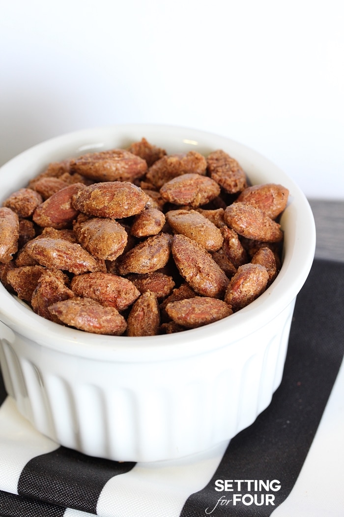 This easy recipe for delicious Pumpkin Pie Spiced Nuts is completely addictive! Makes the perfect snack for game night, holiday parties and great idea for holiday gift giving too! www.settingforfour.com