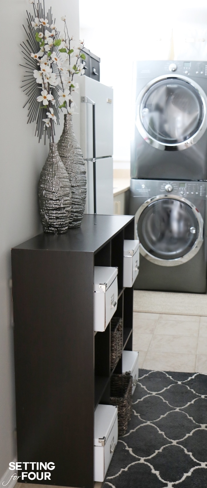 Laundry Room Organization in 3 Easy Steps! All you need to know to organize your laundry room quickly and easily! Use vertical space and stack your washer and dryer. Use a shelving unit is a great idea too! www.settingforfour.com