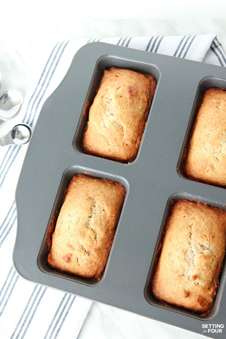 This yummy banana bread recipe is easy to make, has a hint of maple syrup and is perfectly moist and delicious! www.settingforfour.com