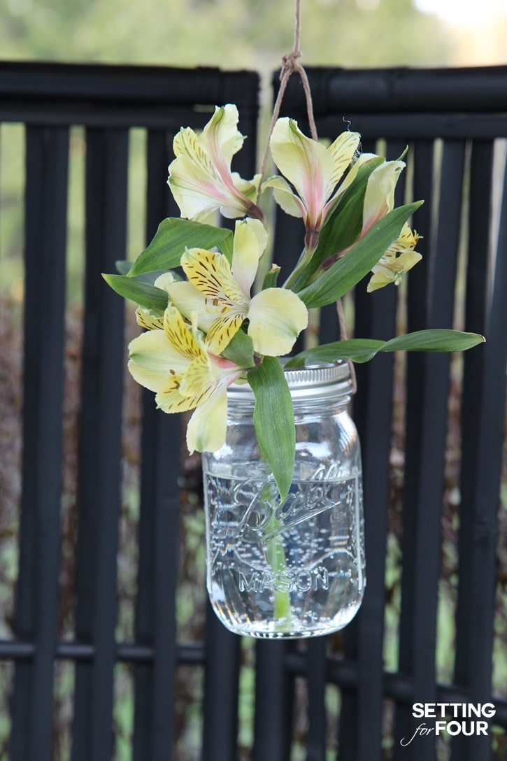 Beautiful flowers in a diy hanging mason jar.