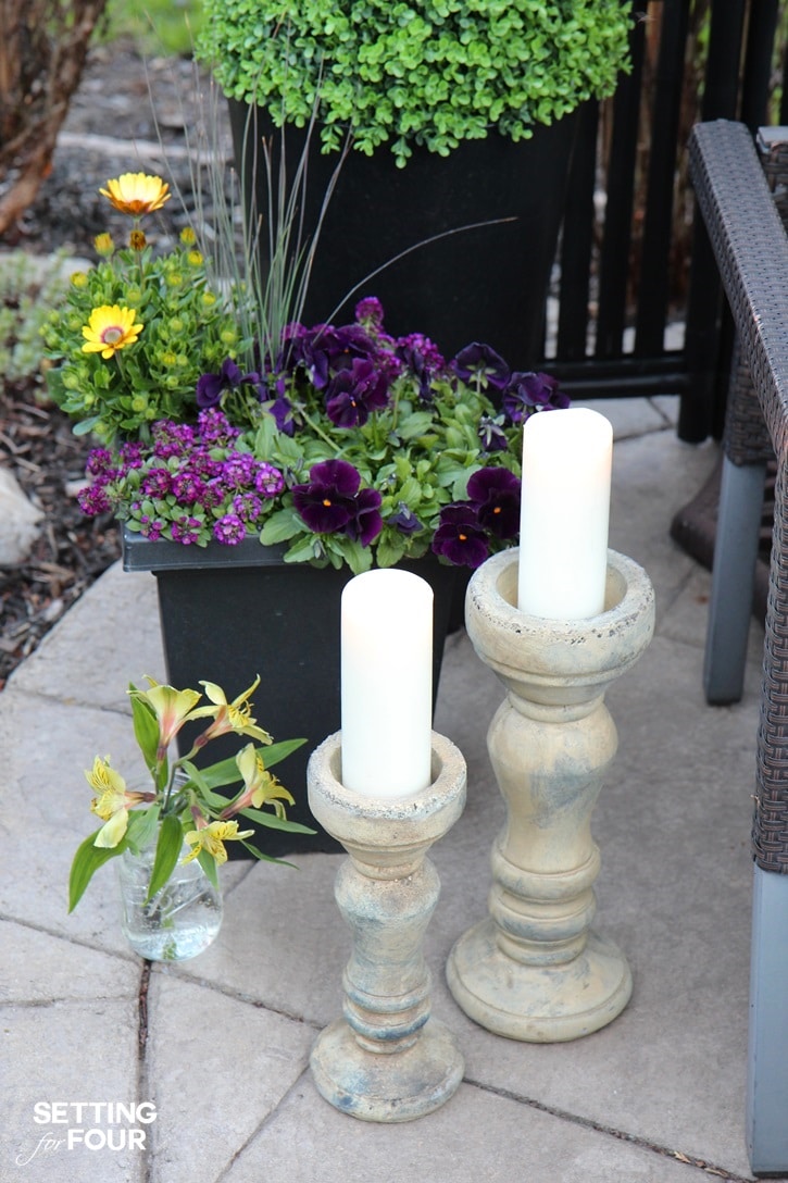 Outdoor container gardening idea using purple and yellow flowering plants.