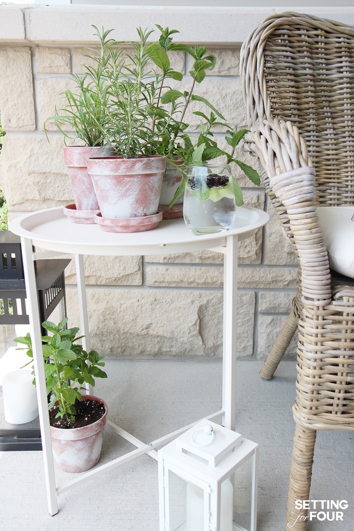 DIY Outdoor Herb Bar - have fresh herbs handy to add to flavor your summer drinks and cocktails! See which herbs in diy whitewashed pots I added to my little bar that are perfect for flavoring summer cocktails and iced teas!