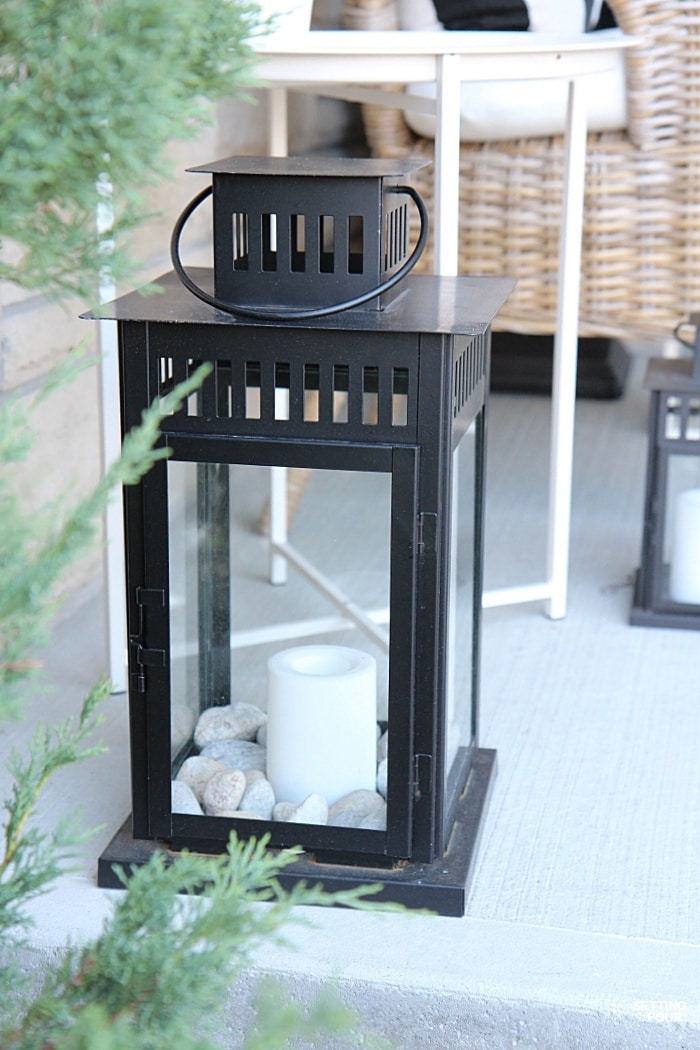 Outdoor lanterns with timers add a pretty twinkle to the front porch at night!