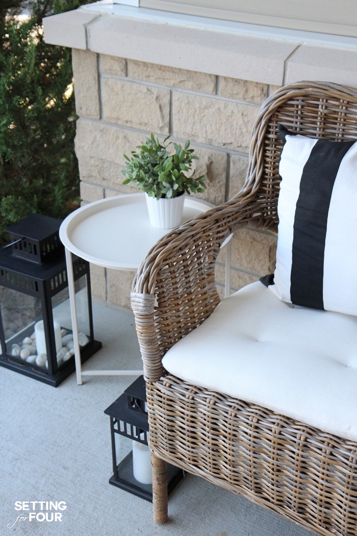 Porch decor tip: Add a small outdoor table to set mail, drinks and plants! See all 10 porch decor ideas from this design blogger's own home!