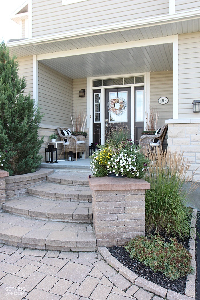 This is the front view of our home. I love the wide curving stone steps, pillars and walkway!