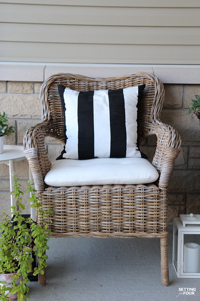 Outdoor wicker chairs with pillows and weatherproof cushions. Perfect for our front porch!