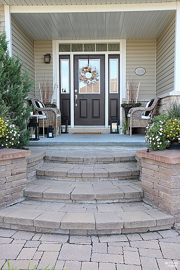 Our home has pretty curb appeal with the gorgeous design of these inlaid stone steps, stone pillars and covered entryway.