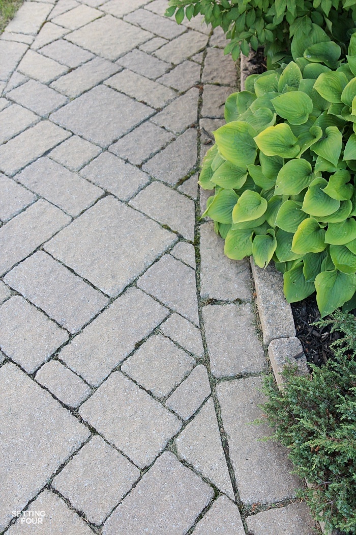 See our inlaid stone pathway and flower beds with hostas!