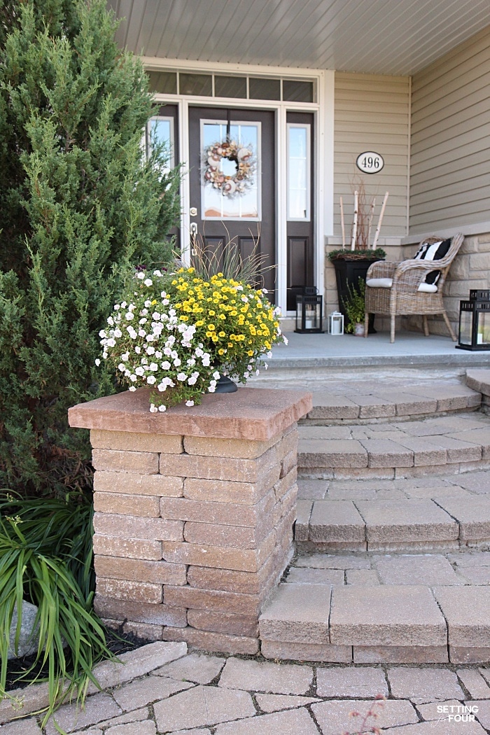 Container gardening idea: Add an urn filled with trailing flowers to each side of your home's front steps for great curb appeal!