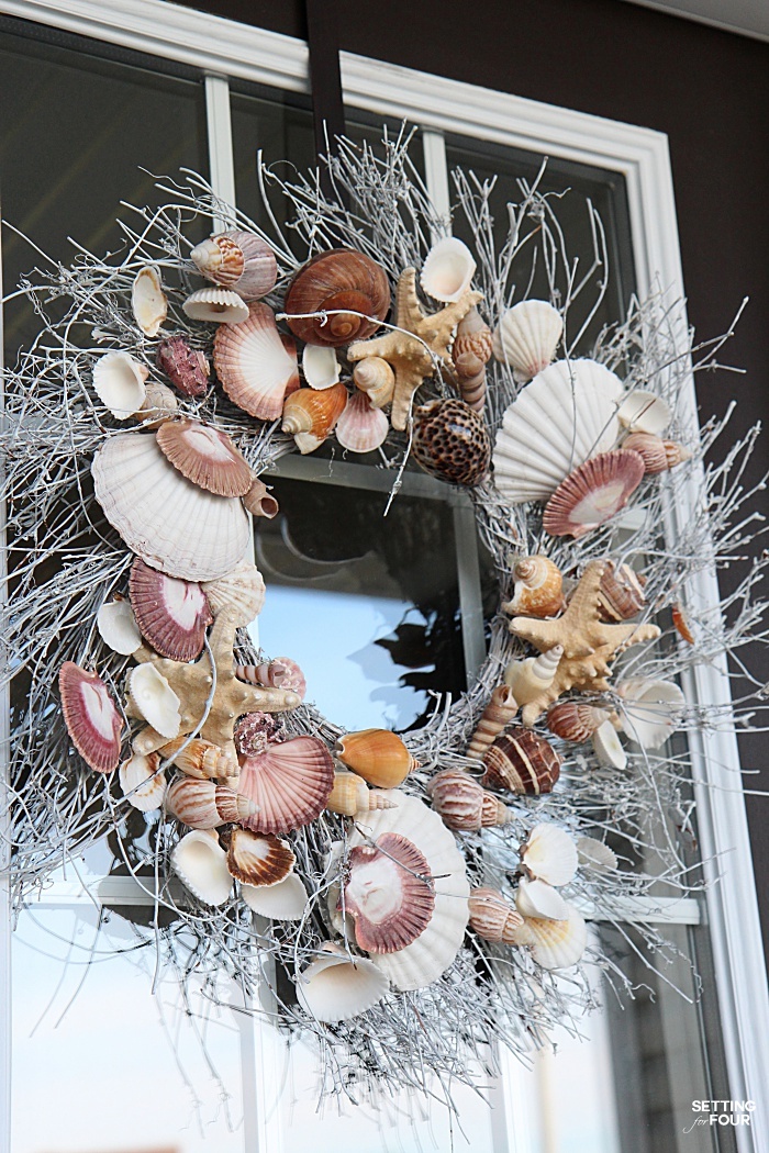 See the wreath hanger I use for our front door wreath. The wreath never falls off and stays put!