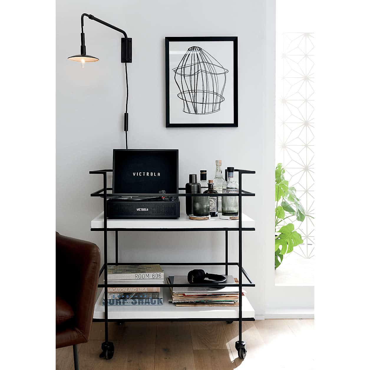 Black and White Bar Cart Decor Ideas, bar cart styling inspiration with a record player, wall sconce and art, books to decorate and barware, record player storage and organization idea.
