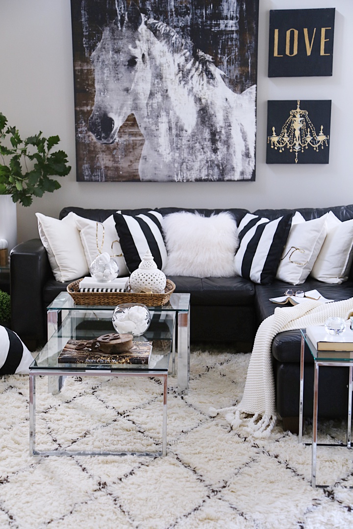 Neutral glam family room decorating ideas for Fall. See this modern leather sectional in a neutral family room and lots of fall decorating tips. This soft Moroccan shag carpet adds coziness to the family room for autumn.