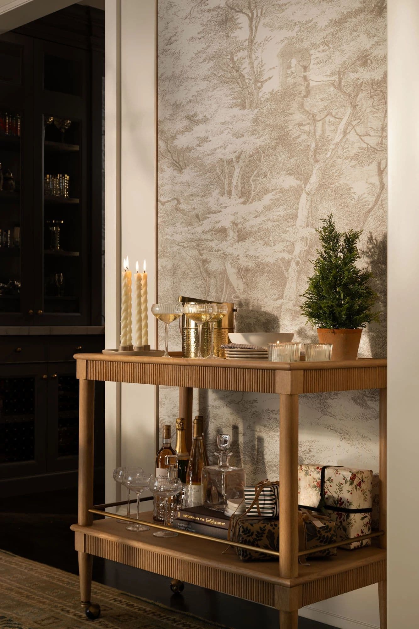 Stylish Christmas Bar Cart Decorating Ideas, Festive Christmas Dining Room Decor Ideas, cozy, elegant, holiday decorating inspiration with a Christmas bar cart, wreaths hung on dining chairs, festive decor, landscape wall art to fill blank walls, moody, earthy color scheme, creamy wall color idea, organic modern, transitional style, Studio McGee home aesthetic