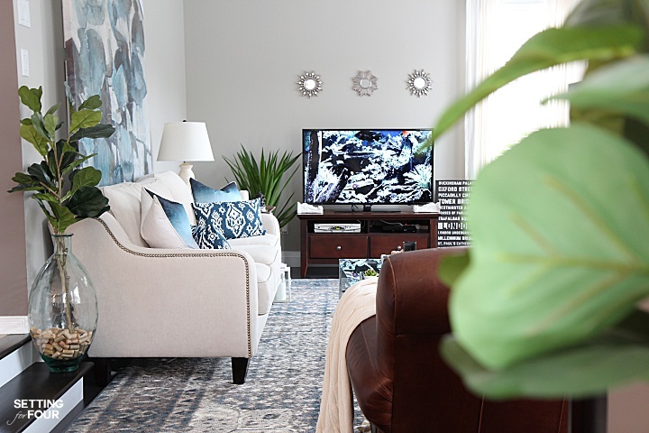  A living room decorated in beautiful indigo blue, cream and gray.