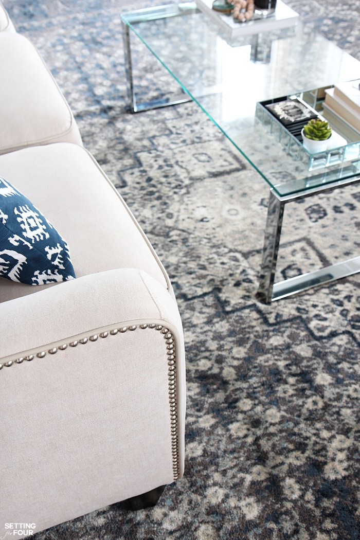 Loving this Indigo Blue Color Scheme for a Living Room - looks gorgeous with this cream sofa and glass and chrome coffee table!