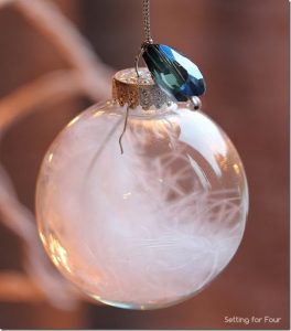 15 Minute is all it takes to make these pretty DIY Jewel and Feather Ball Ornament! Hang on your tree or use as a present or gift bag topper! Great handmade Christmas craft and gift idea.