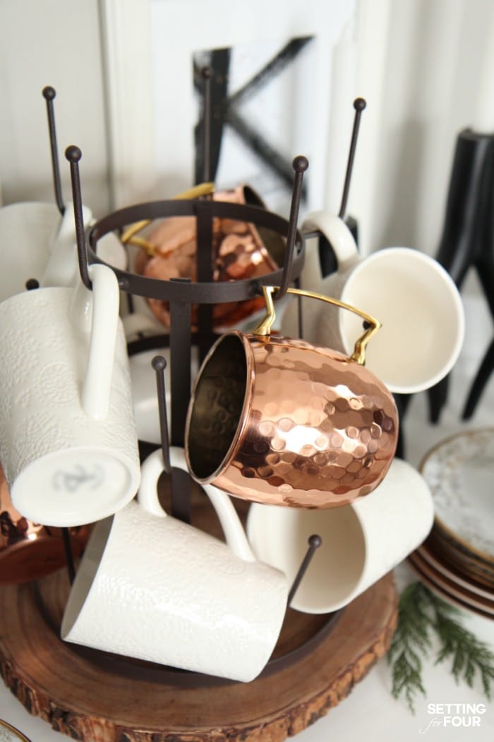 Copper Mugs displayed on a wire glass drying rack.