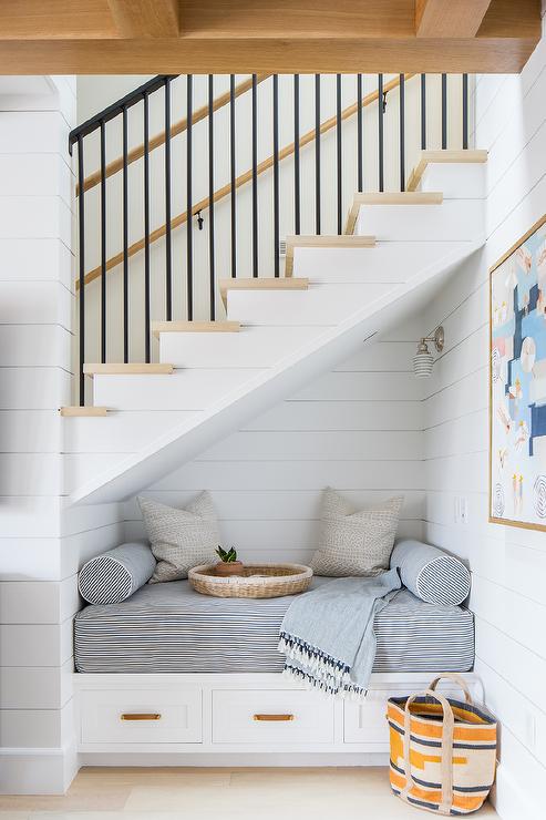 Under The Staircase Nook - create a reading book nook under the staircase