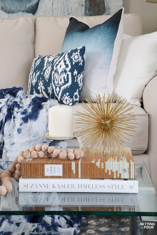 See my coffee table styling tips and ideas using design books and metallic accents!