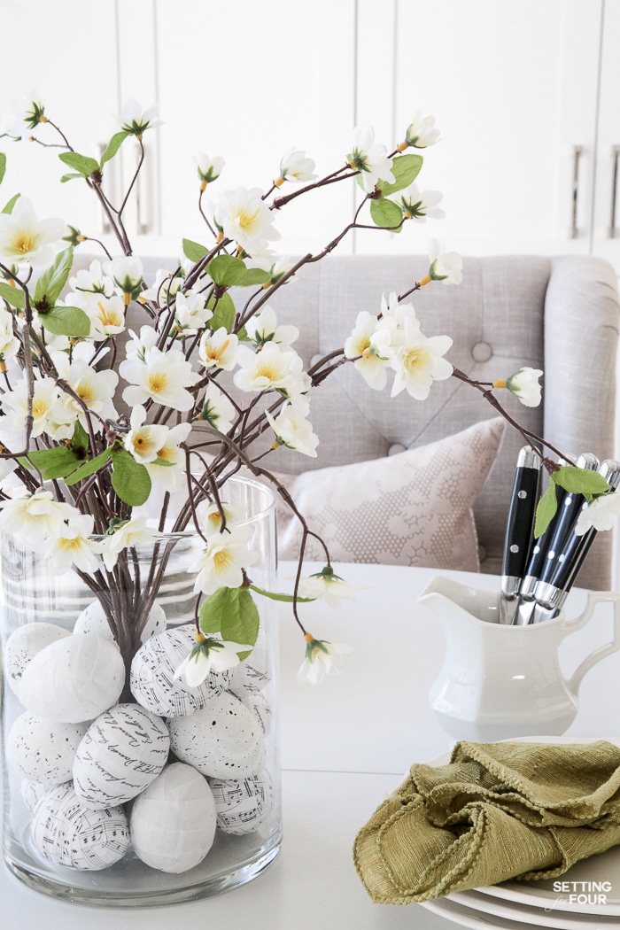 Learn how to make this GORGEOUS quick 10 minute floral arrangement with DIY Easter Egg vase filler! So pretty for a Spring and Easter dining table, kitchen island or coffee table vignette.