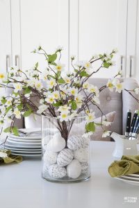 Learn how to make this GORGEOUS quick 10 minute floral arrangement with DIY Easter Egg vase filler! So pretty for a Spring and Easter dining table, kitchen island or coffee table vignette.