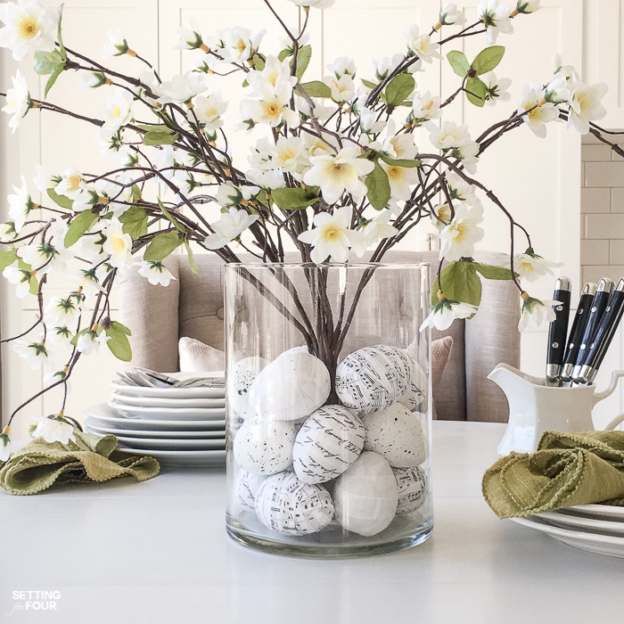 Learn how to make this GORGEOUS quick 10 minute floral arrangement with DIY Easter Egg vase filler! So pretty for a Spring and Easter dining table, kitchen island or coffee table vignette.