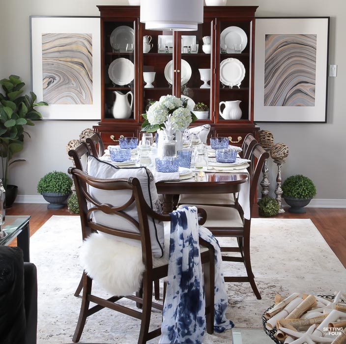 Summer home tour and summer decorating ideas. Dining room with DIY Marbled art, blue dishes, blue hydrangea centerpiece, fiddle leaf fig tree, antique furniture, ironstone dishes, vintage area rug.